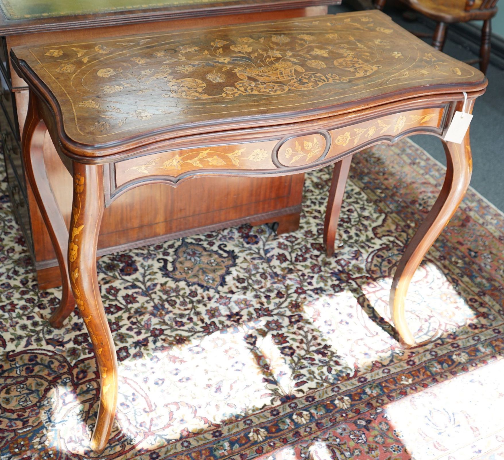 A 19th century Dutch mahogany and marquetry games table, width 85cm depth 43cm height 75cm